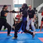 Yasmin and Paul practicing martial arts at WCJJM